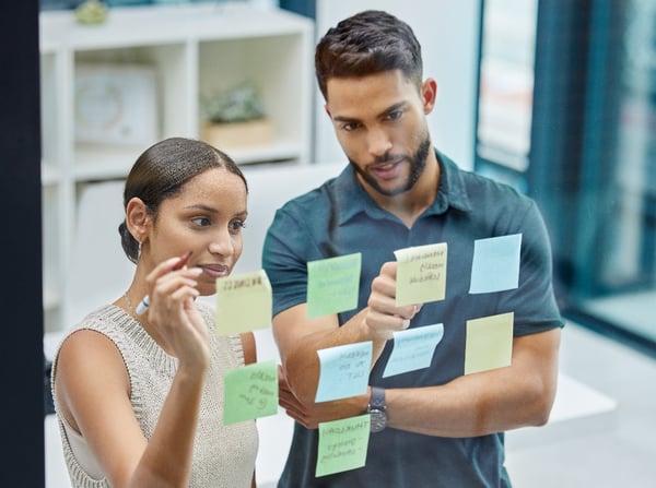 shot-of-two-businesspeople-brainstorming-with-stic-2023-01-10-22-52-52-utc-1