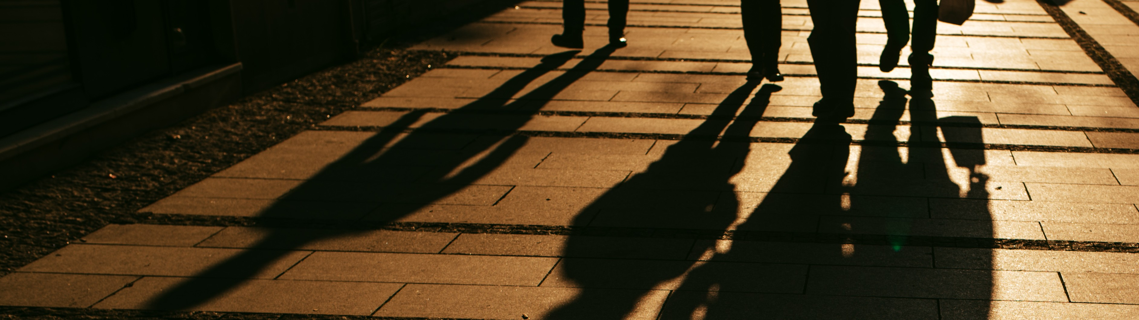 silhouettes-of-people-walking-on-city-street-2024-12-06-00-54-11-utc